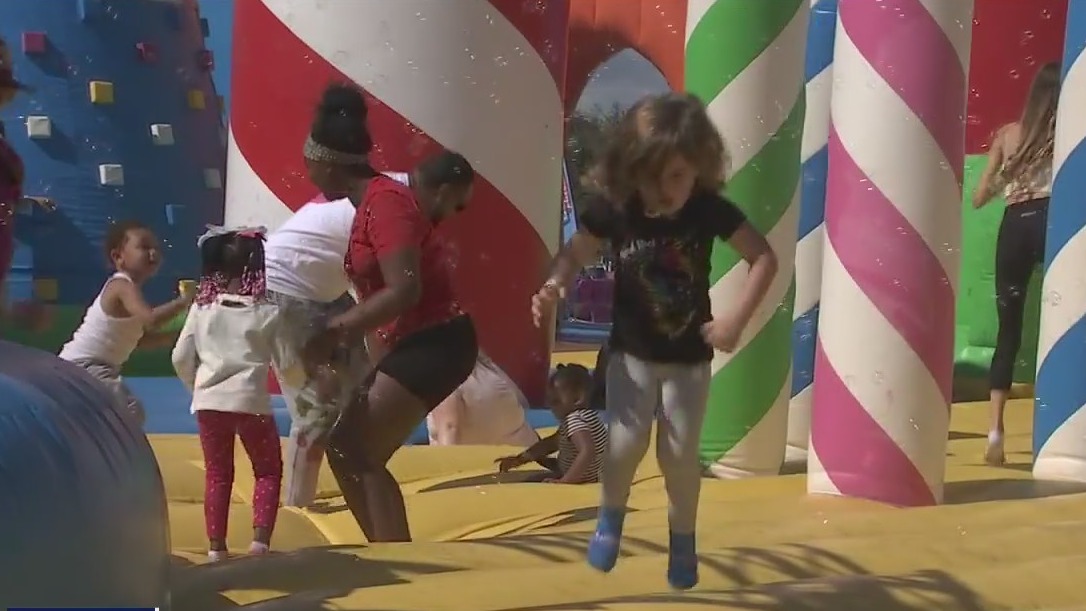 Kids, adults enjoy world's largest bounce house